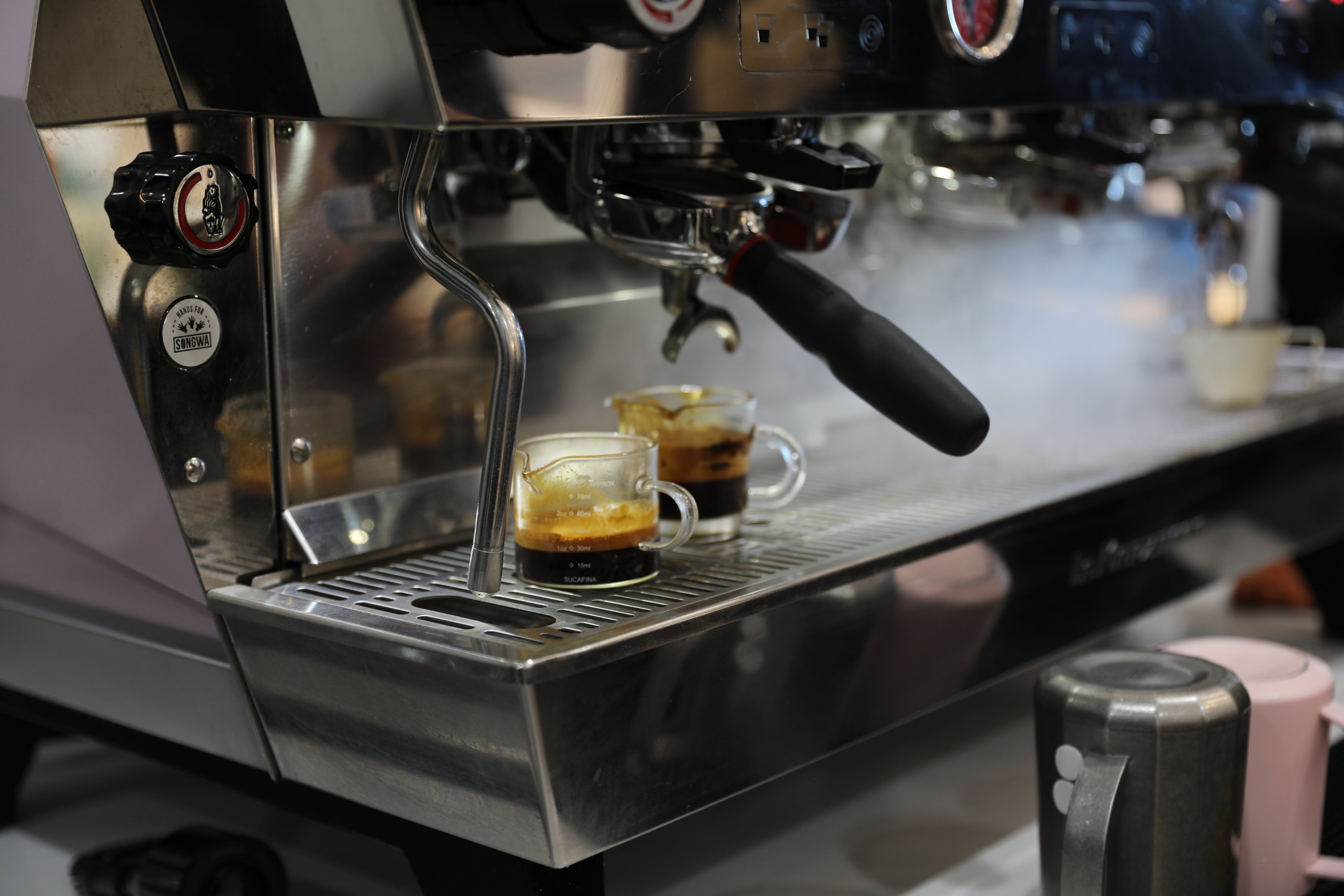 Espresso being prepared with care