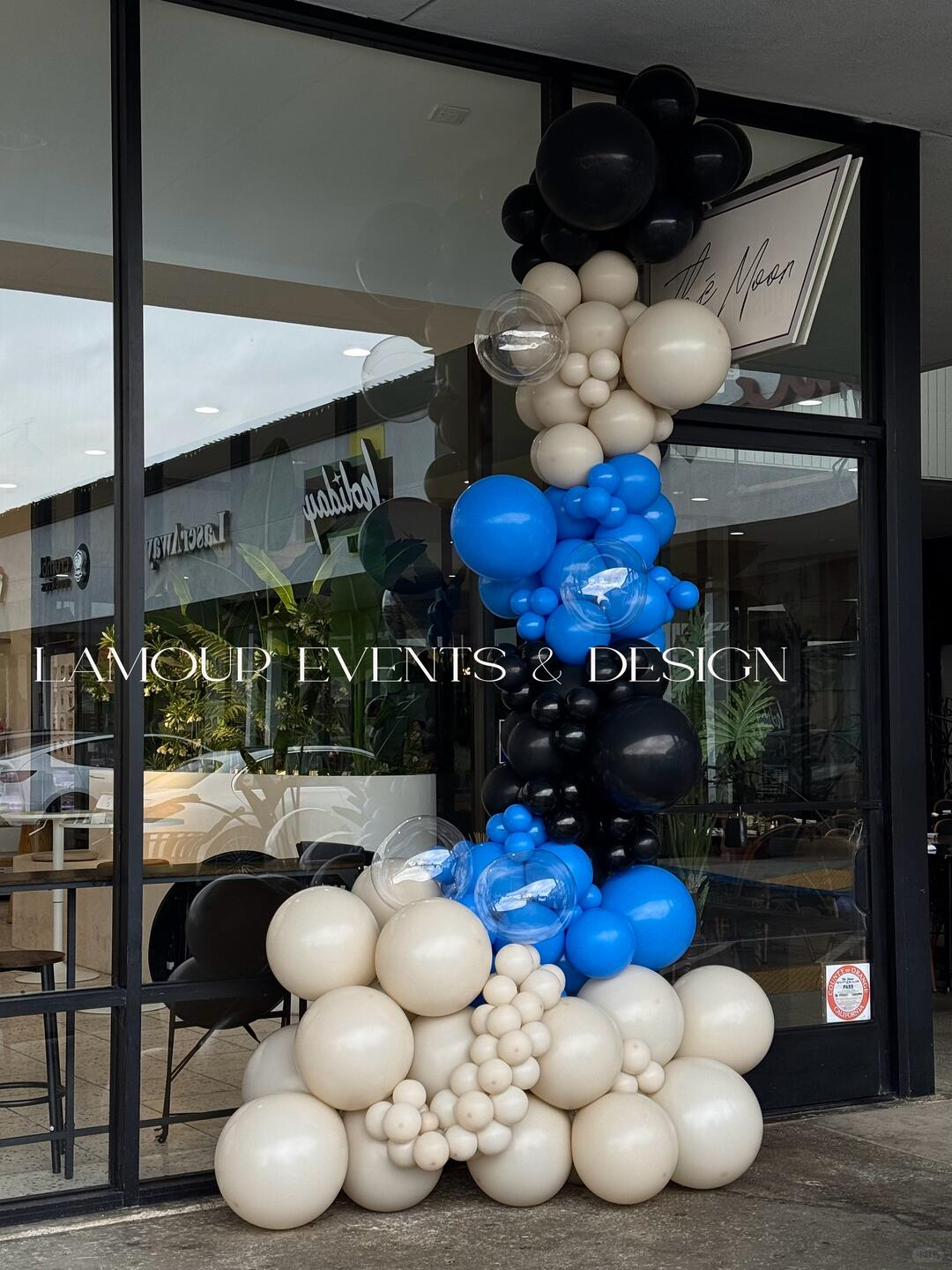 The Moon storefront decorated for a community event